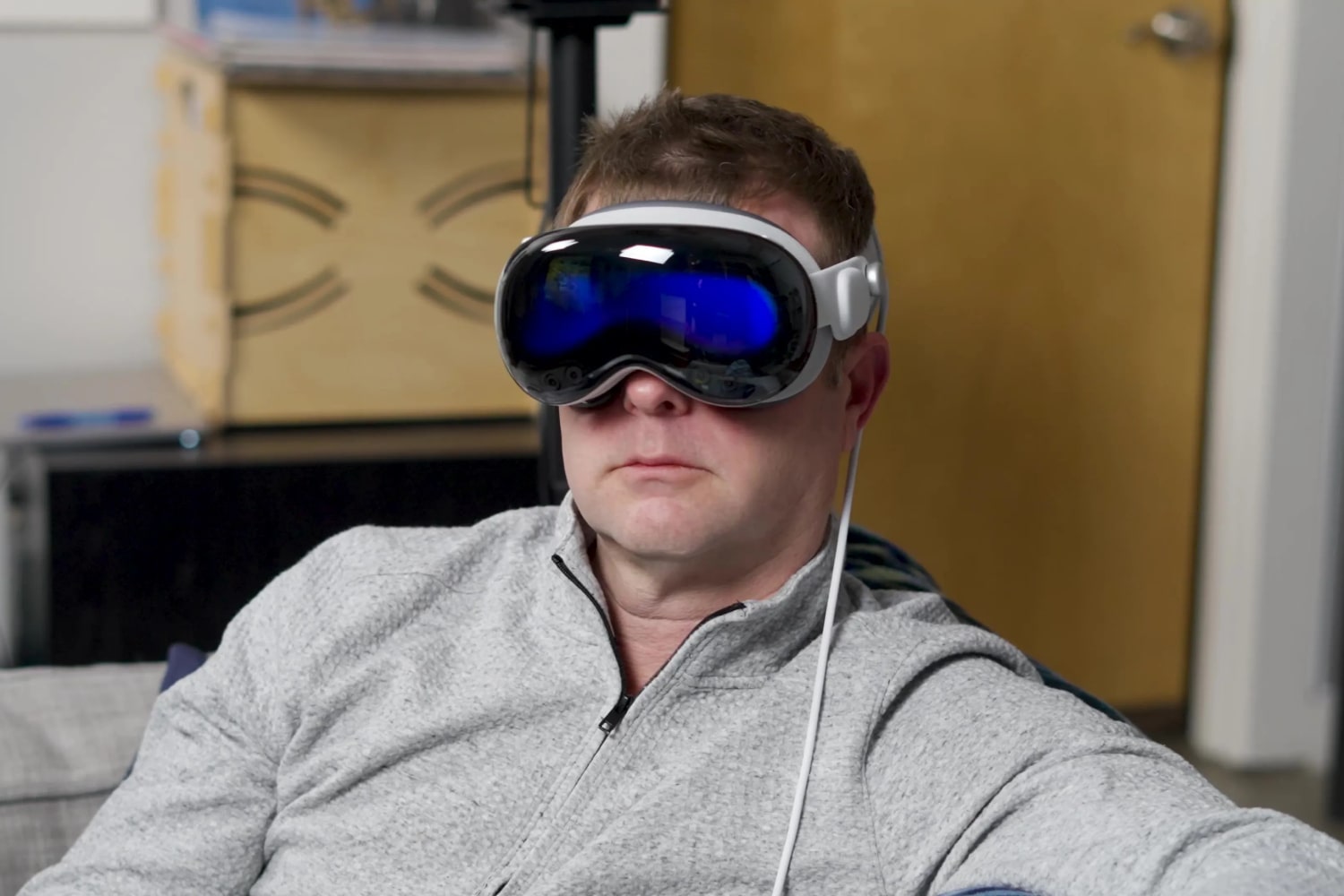 Man experiencing immersive technology with an Apple Vision Pro headset.