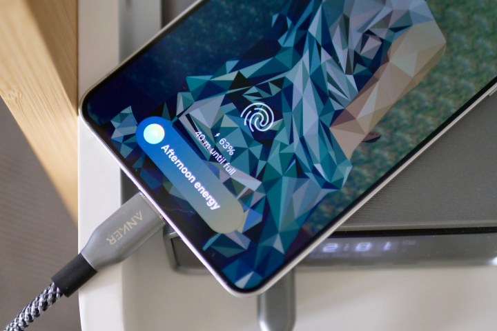 The Samsung Galaxy S25 Edge connected to a charger, indicating its charging status