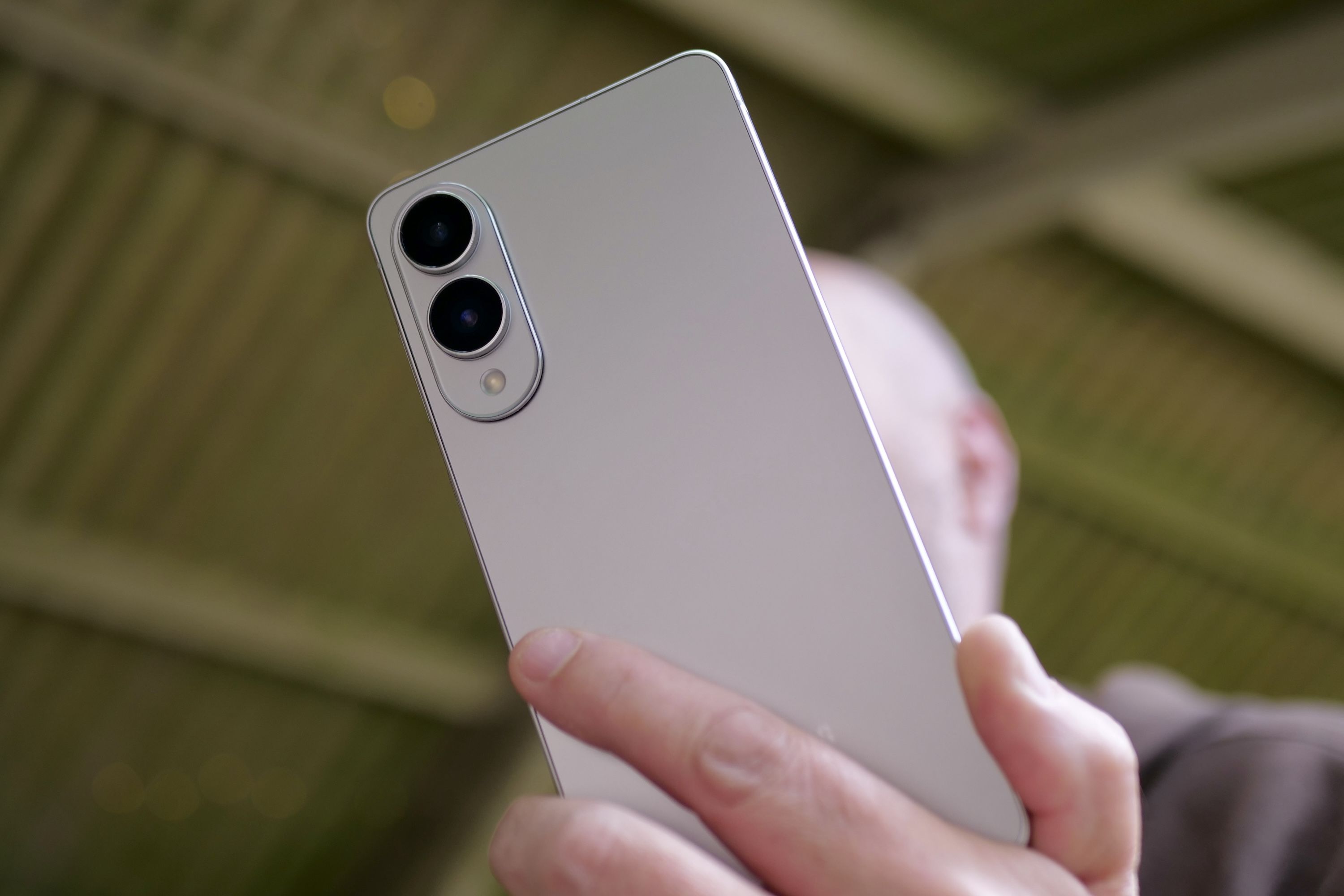 User holding the sleek Samsung Galaxy S25 Edge, demonstrating its slim profile and premium feel.