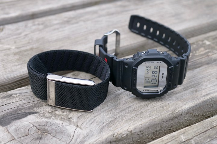 Size comparison of the Whoop MG fitness tracker (left) next to a Casio G-Shock watch (right).