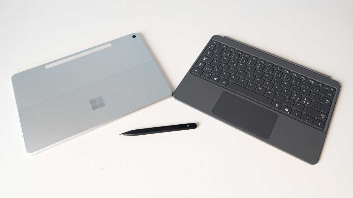 Microsoft Surface Pro 2025 shown with its optional keyboard and Slim Pen, essential accessories for productivity.