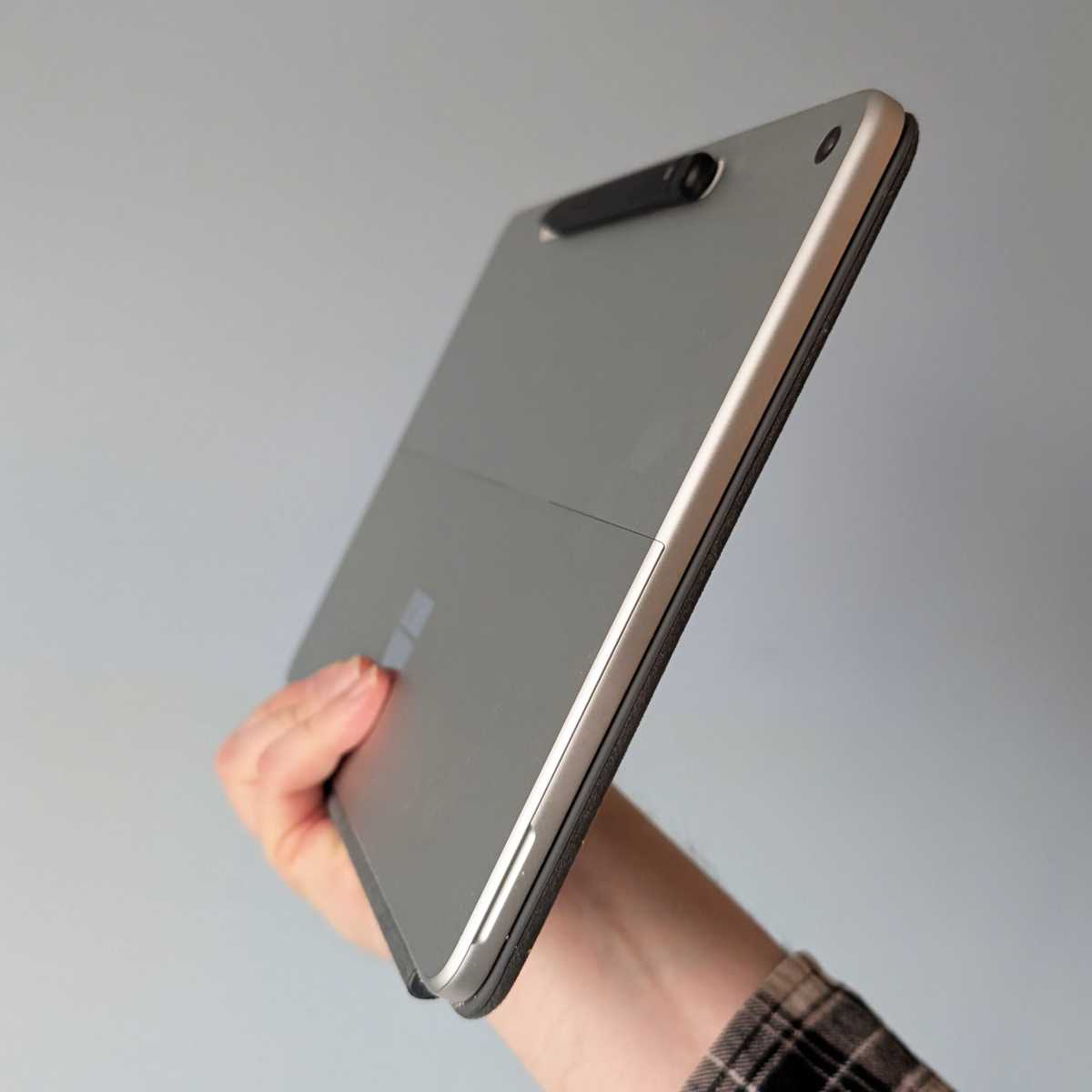 The Microsoft Surface Pro 2025 with its keyboard cover closed, appearing like a sleek, compact notebook.