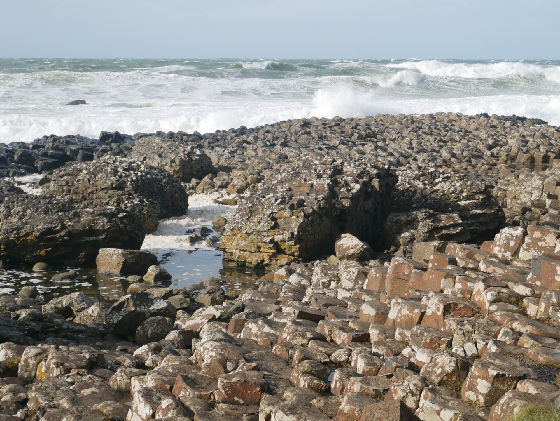 Close-up of the iconic interlocking basalt pillars at Giant's Causeway, a 60-million-year-old geological formation in Northern Ireland.