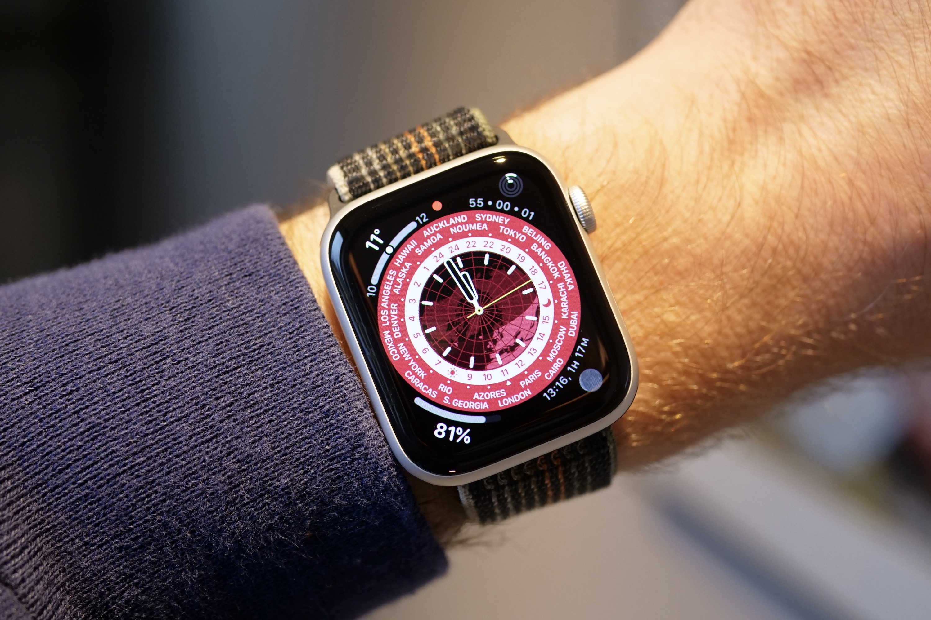 alt text: The World Time watch face displayed on the Apple Watch SE 2.