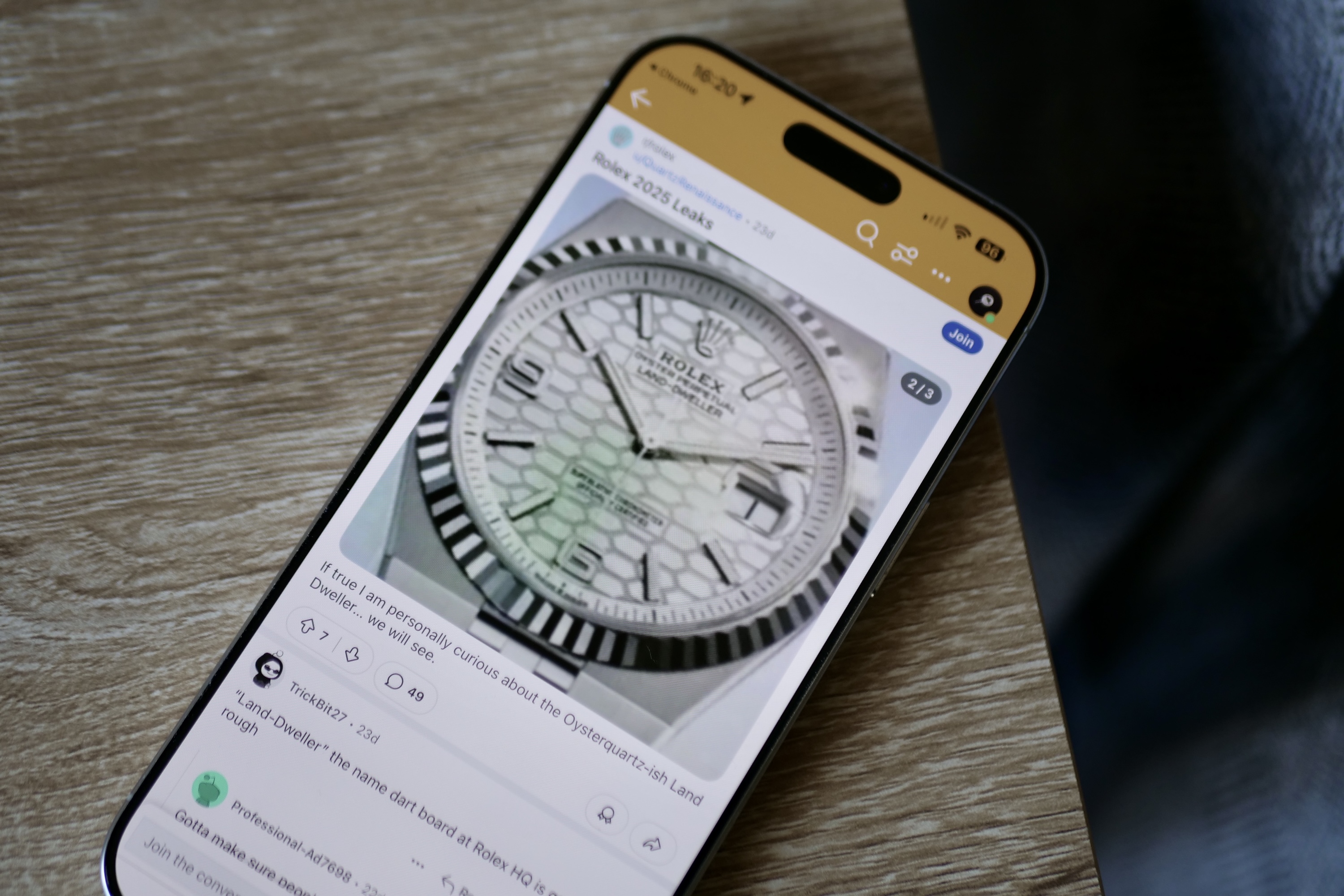 An iPhone 16 Pro Max displaying a watch face similar to the Rolex Explorer.