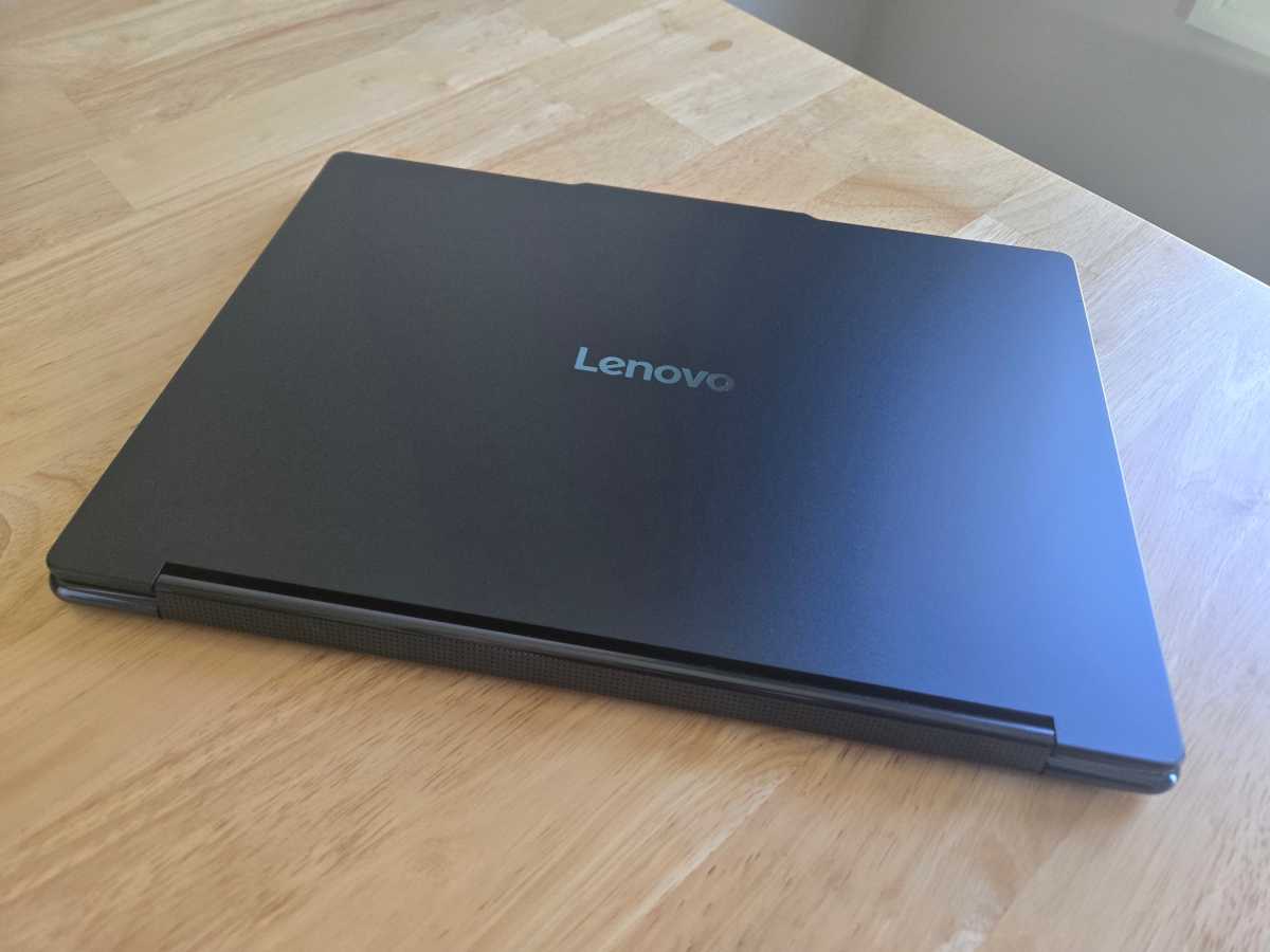 Angled view of the sleek Lenovo Yoga 9i 2-in-1 Aura Edition laptop showcasing its premium design and convertible form factor.