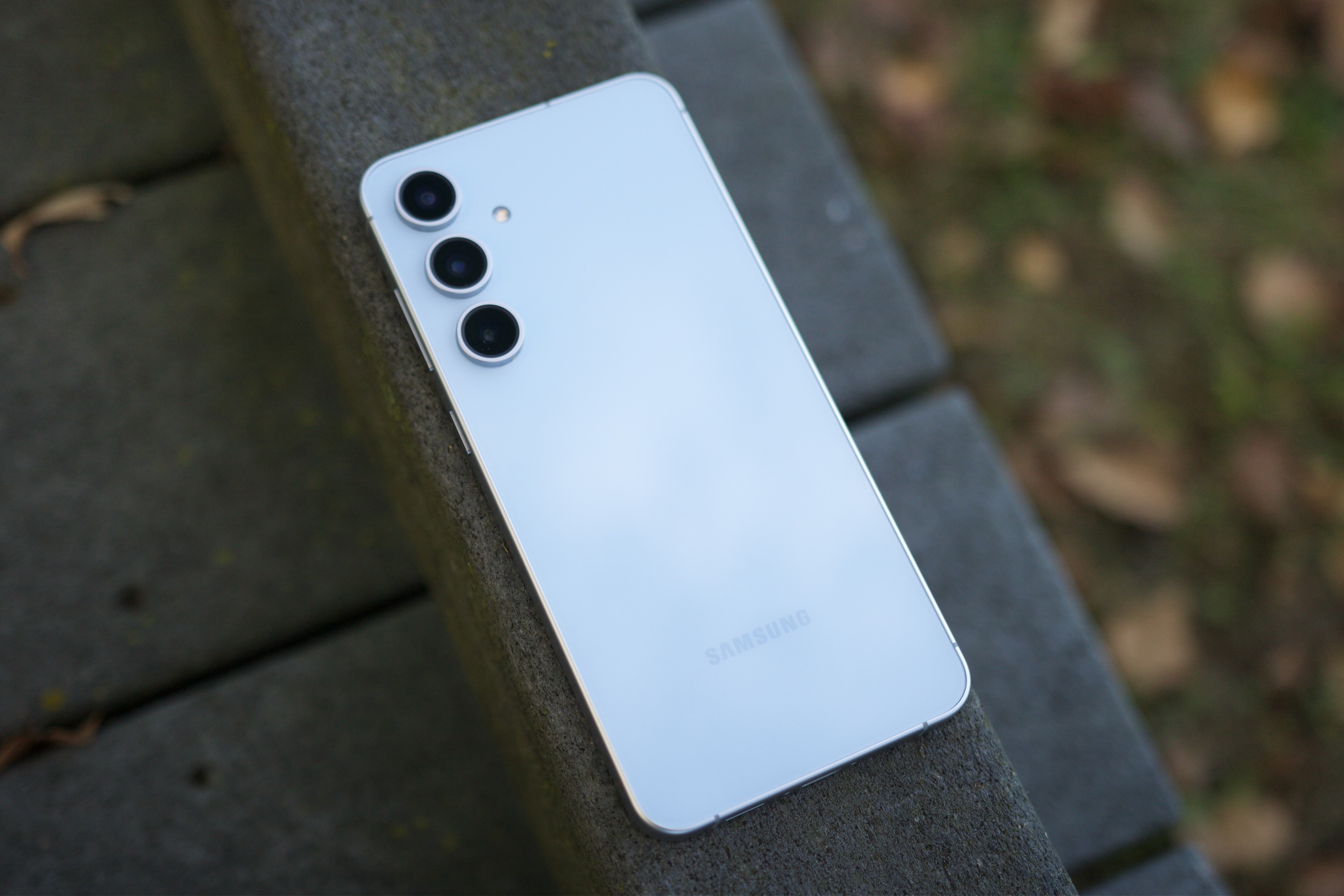 Samsung Galaxy S25 FE lying face-down outside