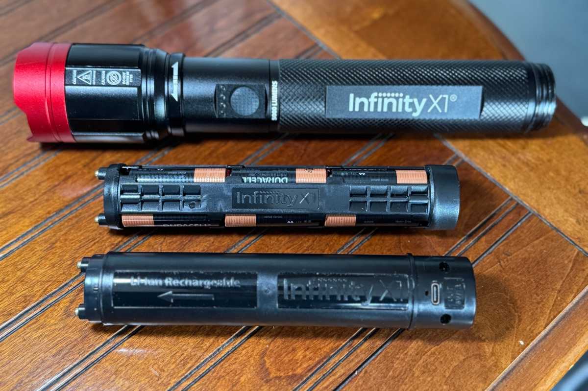 Infinity X1 flashlight showcasing its versatile dual power system with the rechargeable Li-ion battery pack alongside the AA battery cartridge.