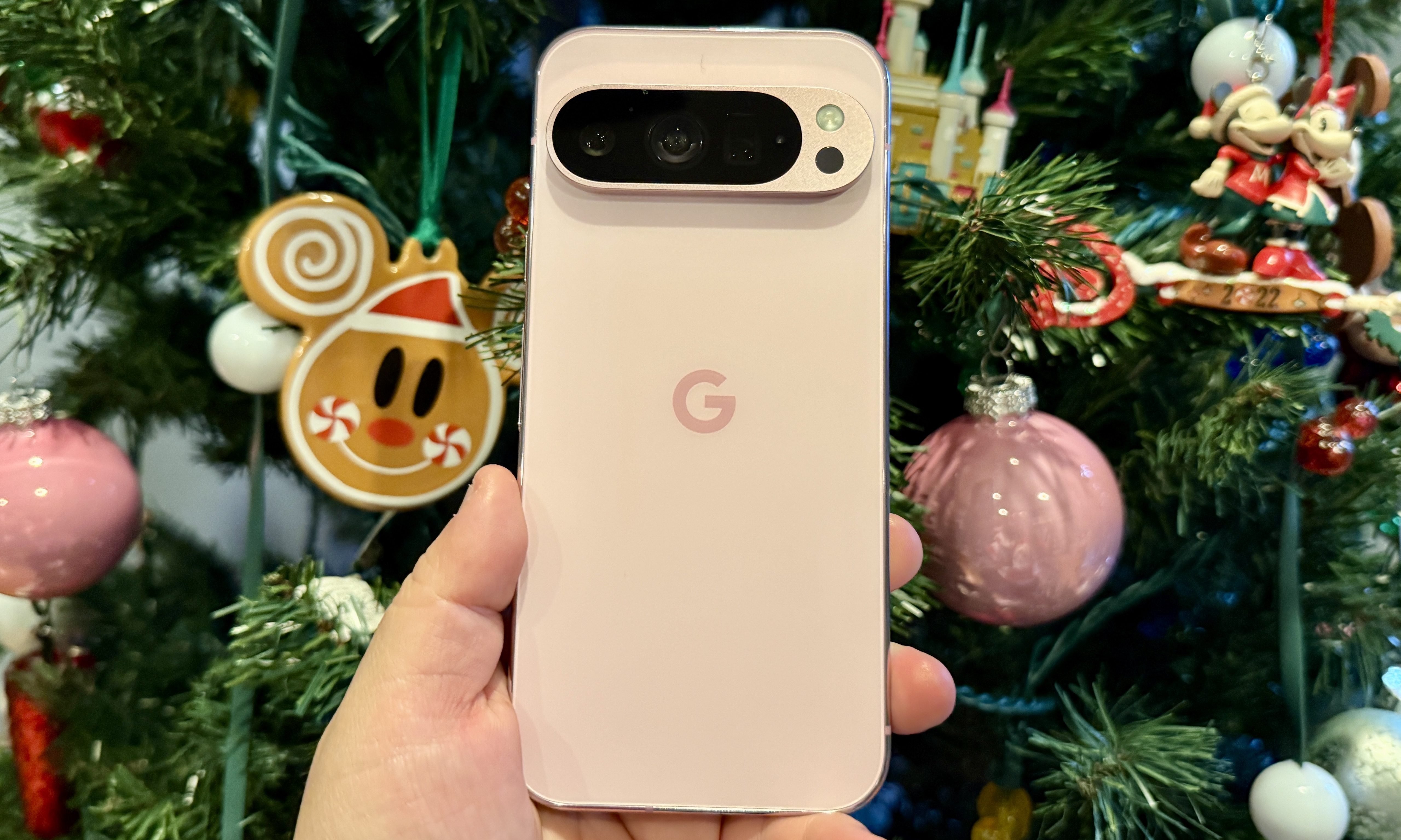Rose gold Google Pixel phone on a festive background, symbolizing the AI-driven future anticipated for the Pixel 10 series from Google I/O 2025 insights.