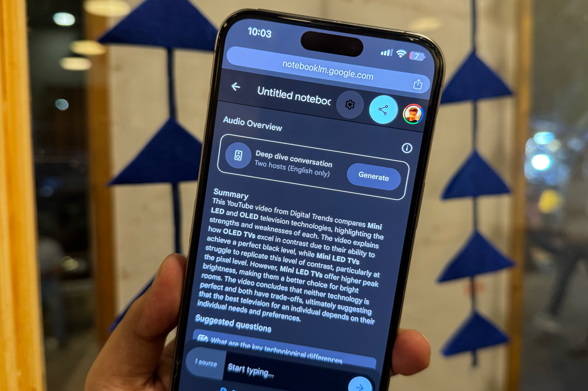 A person holding a smartphone displaying the Google NotebookLM interface, symbolizing interactive learning and on-demand knowledge access through the app.