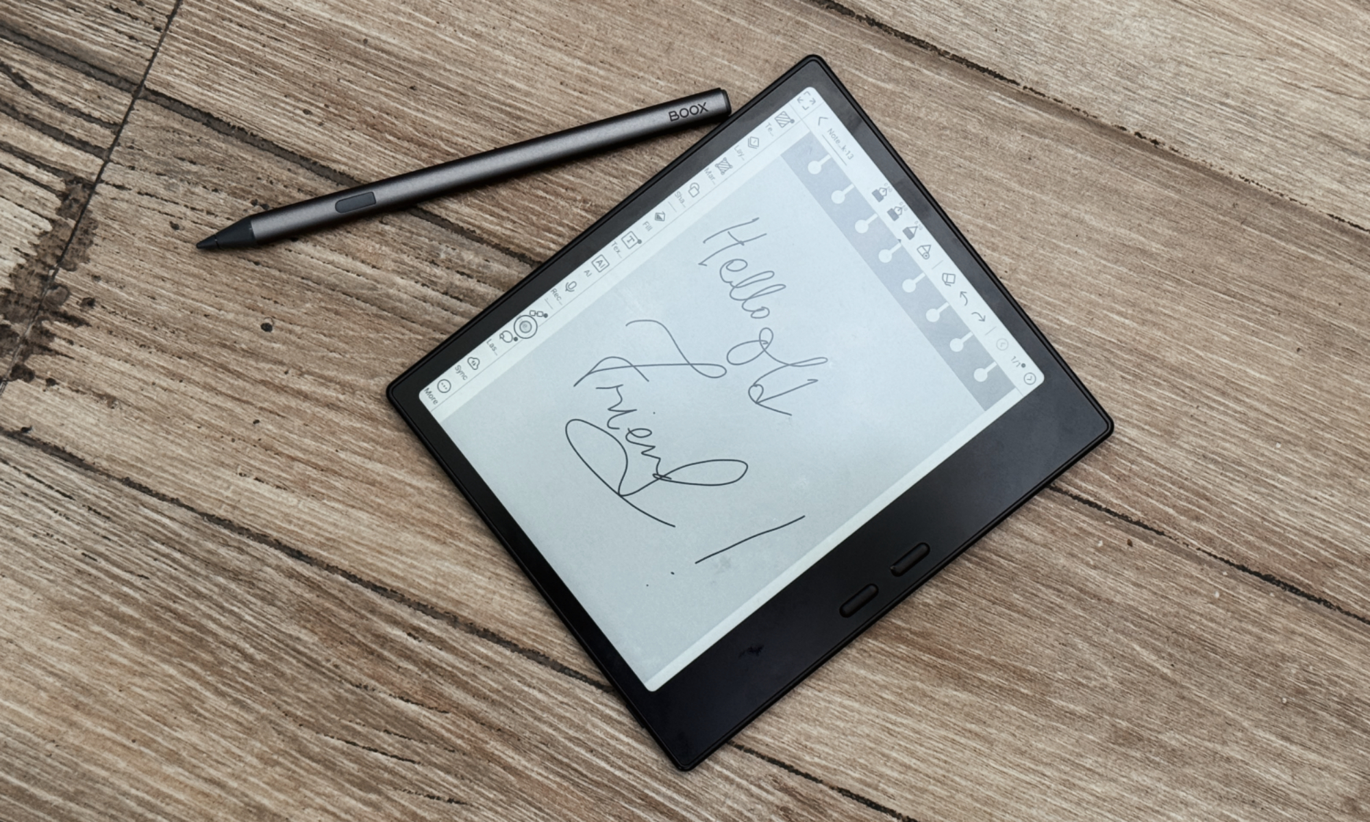 Boox Go 7 E Ink tablet home screen with app icons, alongside the Boox Pen Plus stylus.