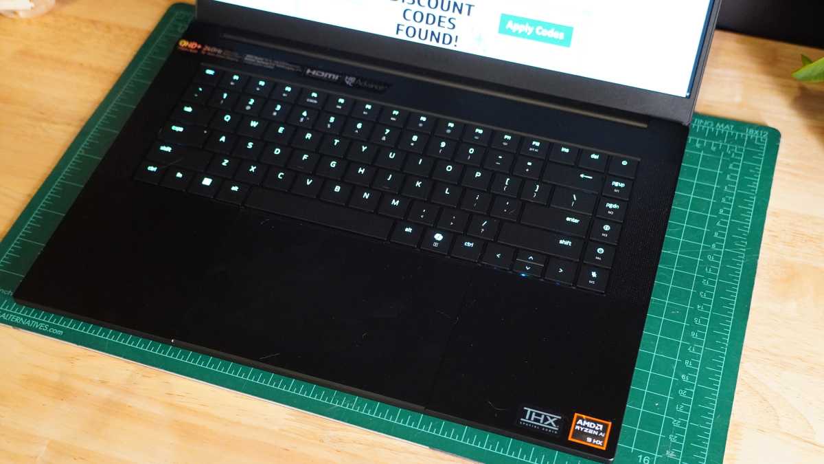 Close-up of the Razer Blade 16 2025 keyboard with per-key RGB lighting and the large trackpad.