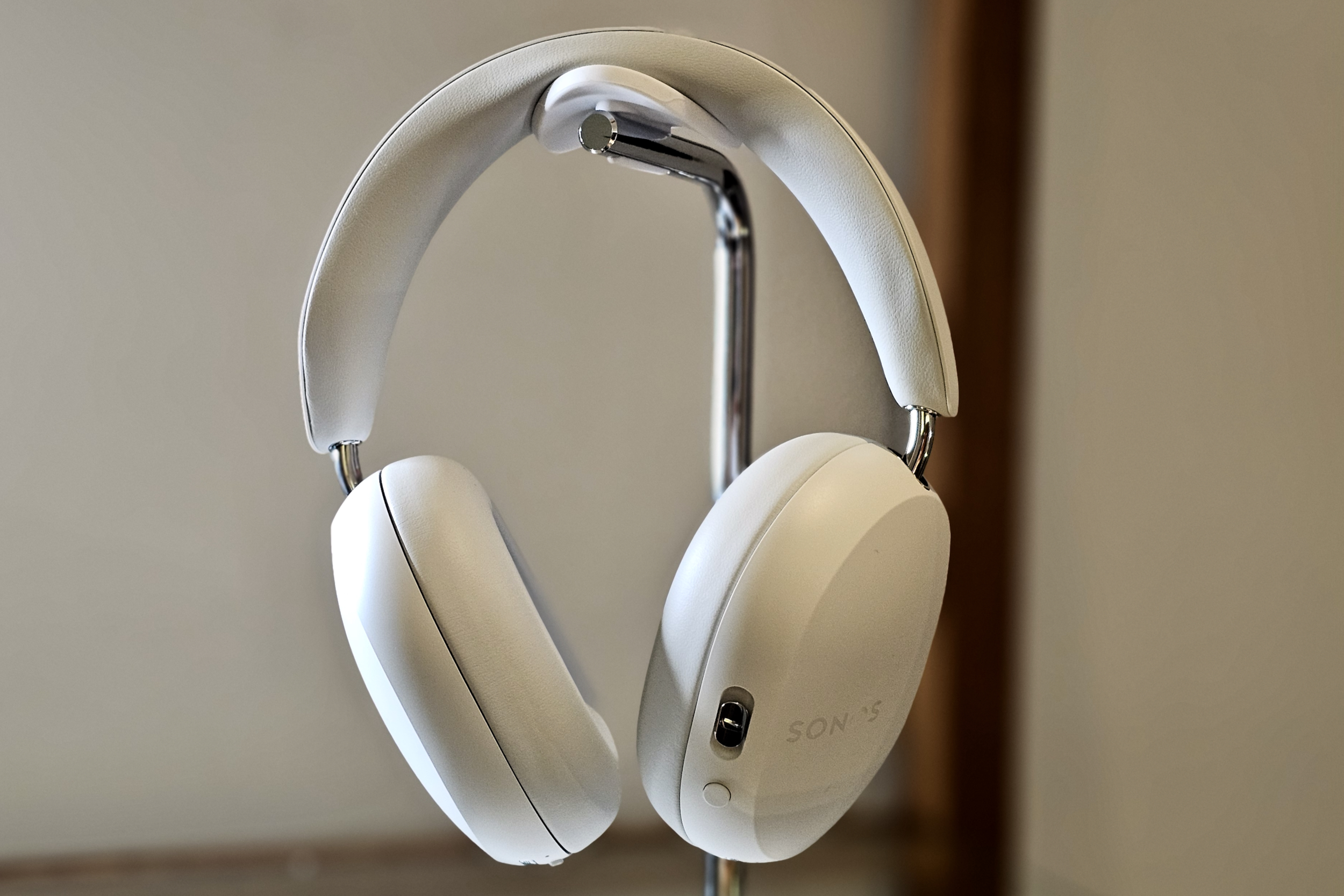 Sonos Ace wireless headphones in soft white, showcasing their premium design.
