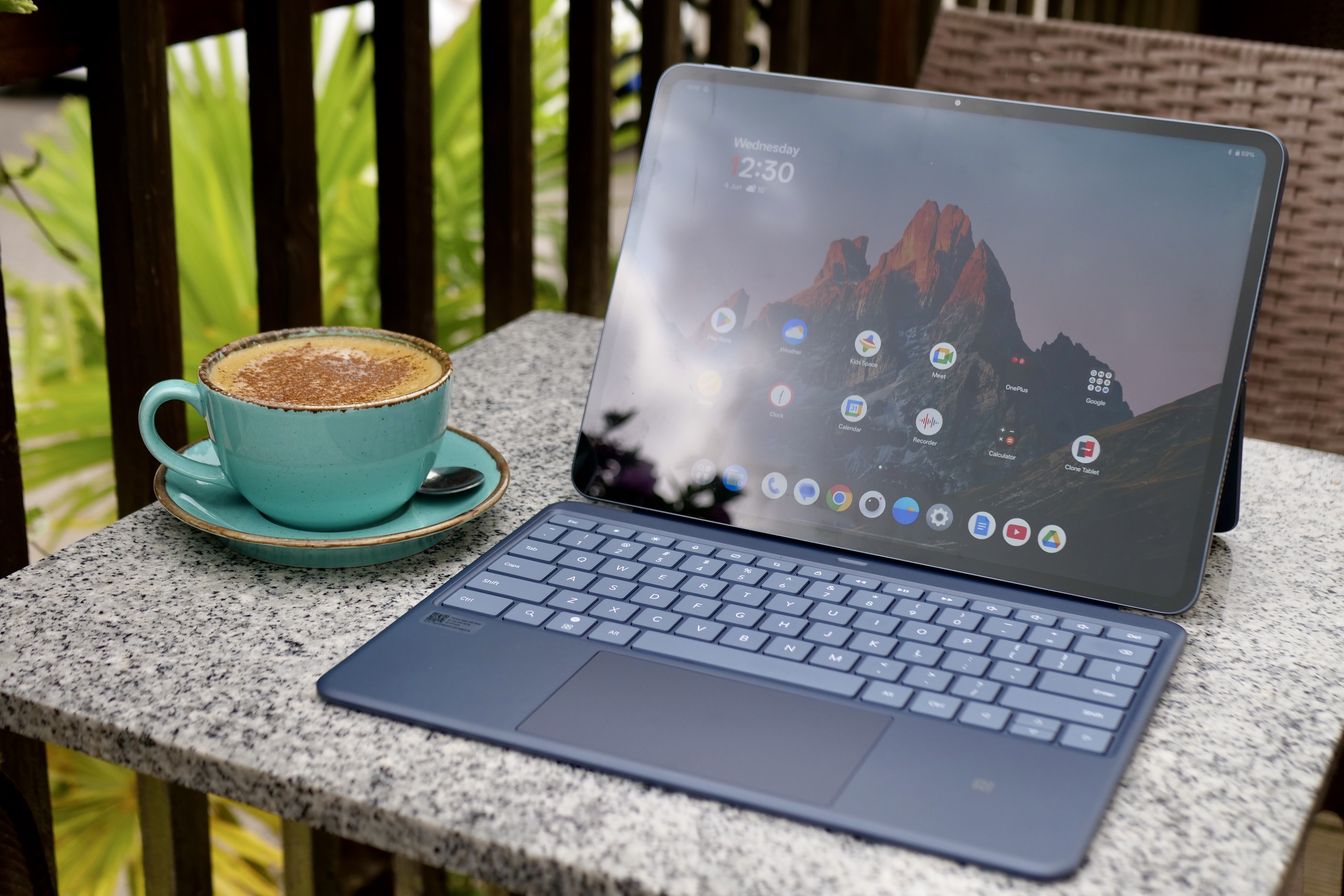 OnePlus Pad 3 attached to its official keyboard accessory, set up for productivity tasks.