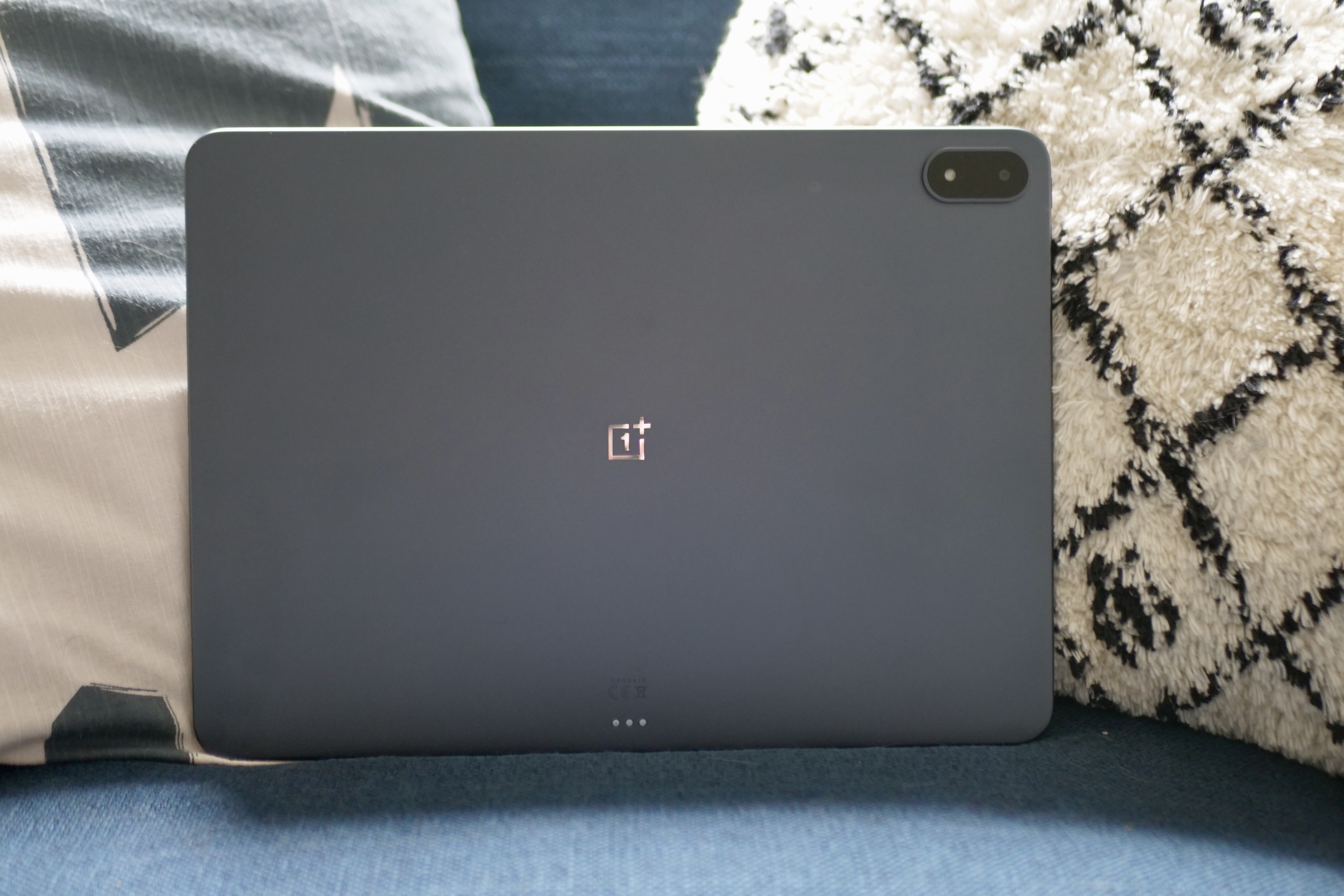 The sleek Storm Blue aluminum back panel of the OnePlus Pad 3, reflecting its premium build.