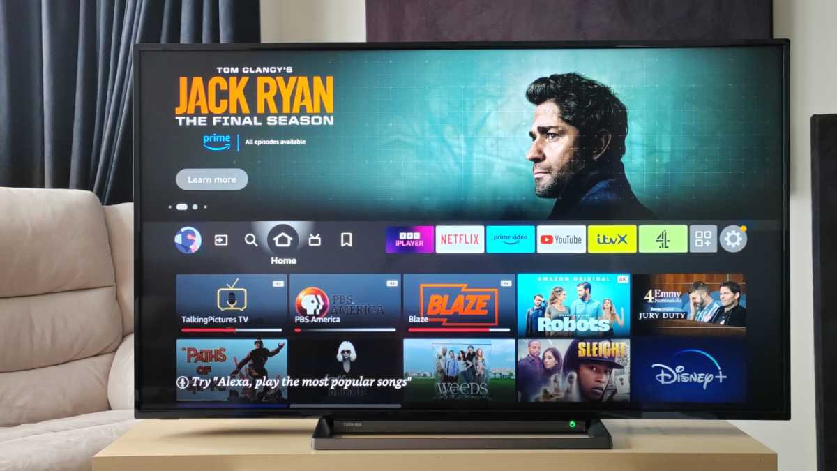 A modern smart TV in a living room, symbolizing a device taken offline to enhance home network security.