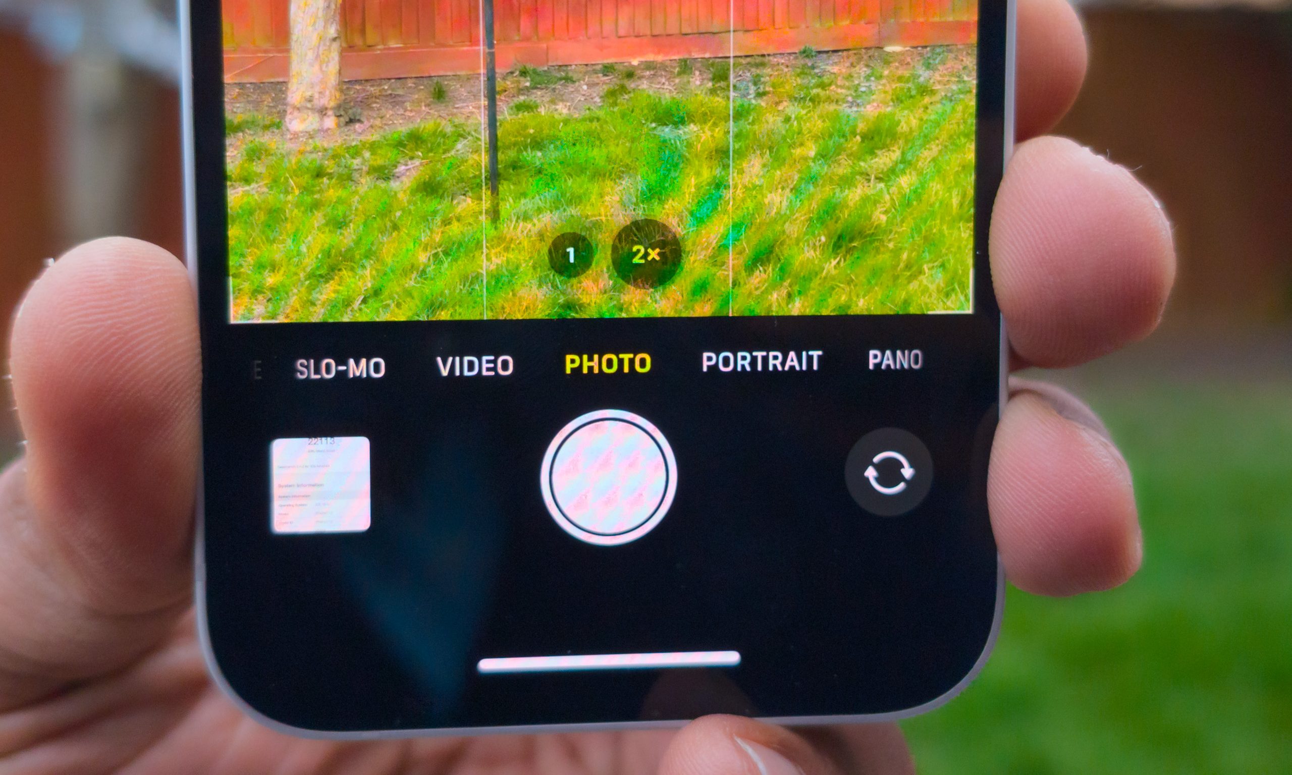 Close-up of an iPhone's rear camera lenses, highlighting potential iOS 26 camera app improvements.