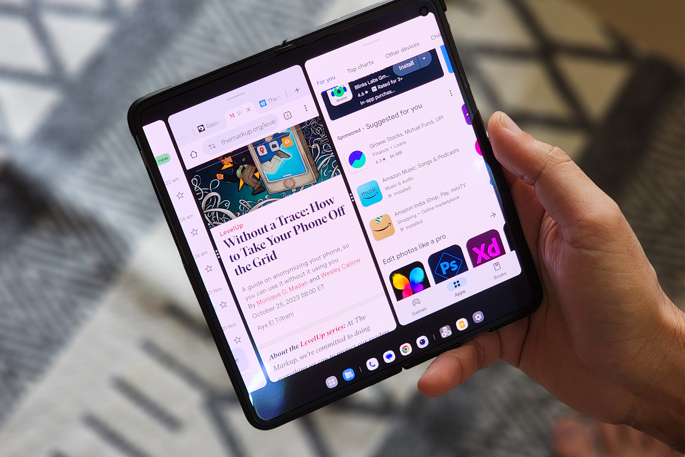 OnePlus Open foldable phone demonstrating true multitasking with three apps running side-by-side, a feature hoped for in iOS 19.