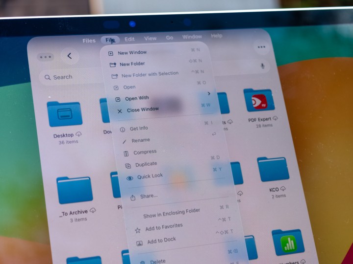 The new Files app in iPadOS 26 showcasing the redesigned File menu on an iPad Pro M4 display.