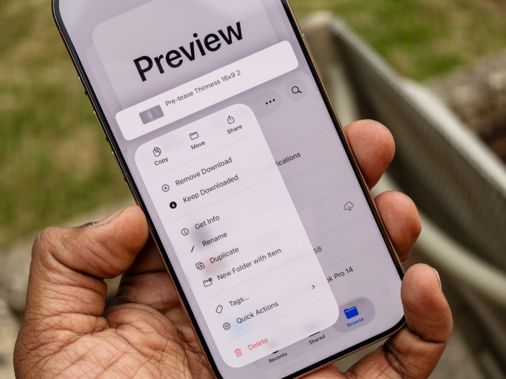 The new Preview app interface on iOS 26 beta for iPhone, with a grid view of documents, enhancing productivity.