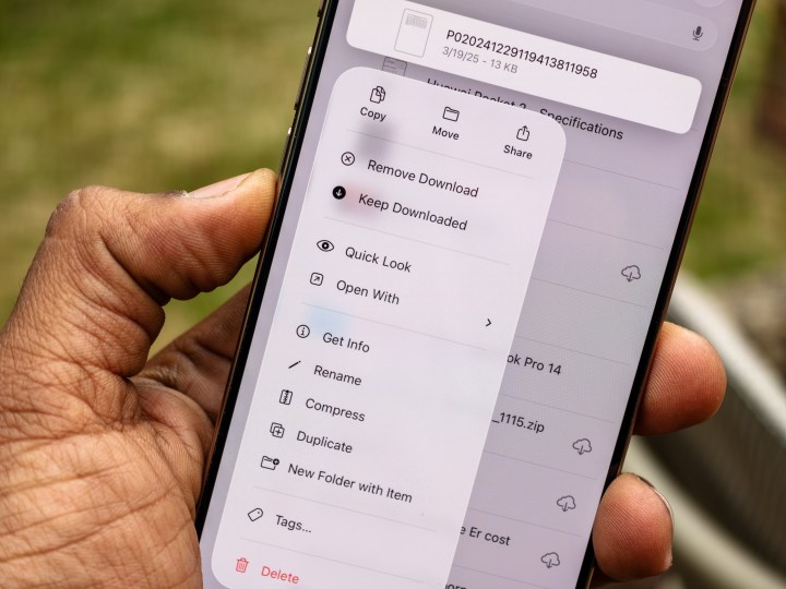 Enhanced Files app in iOS 26 beta on iPhone 16 Pro, showing a detailed context menu with file management options.