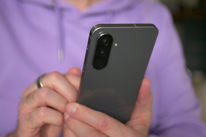 User holding the Samsung Galaxy A56, highlighting its comfortable grip and screen visibility.