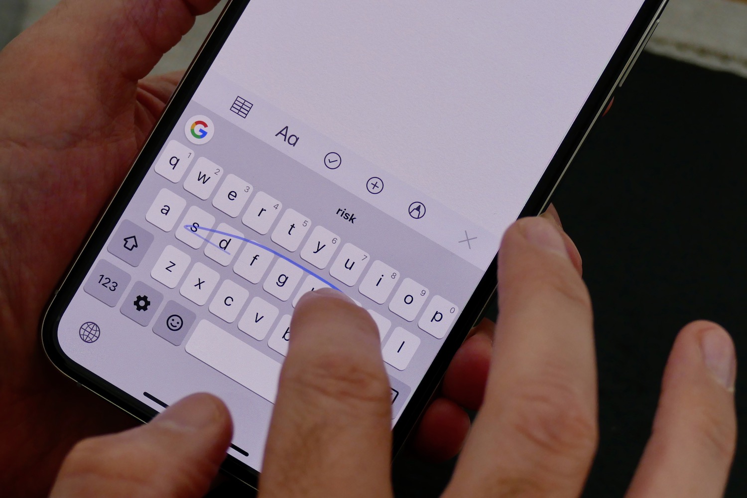 Google's Gboard keyboard app shown on an iPhone screen, highlighting instability issues with third-party keyboards in iOS.