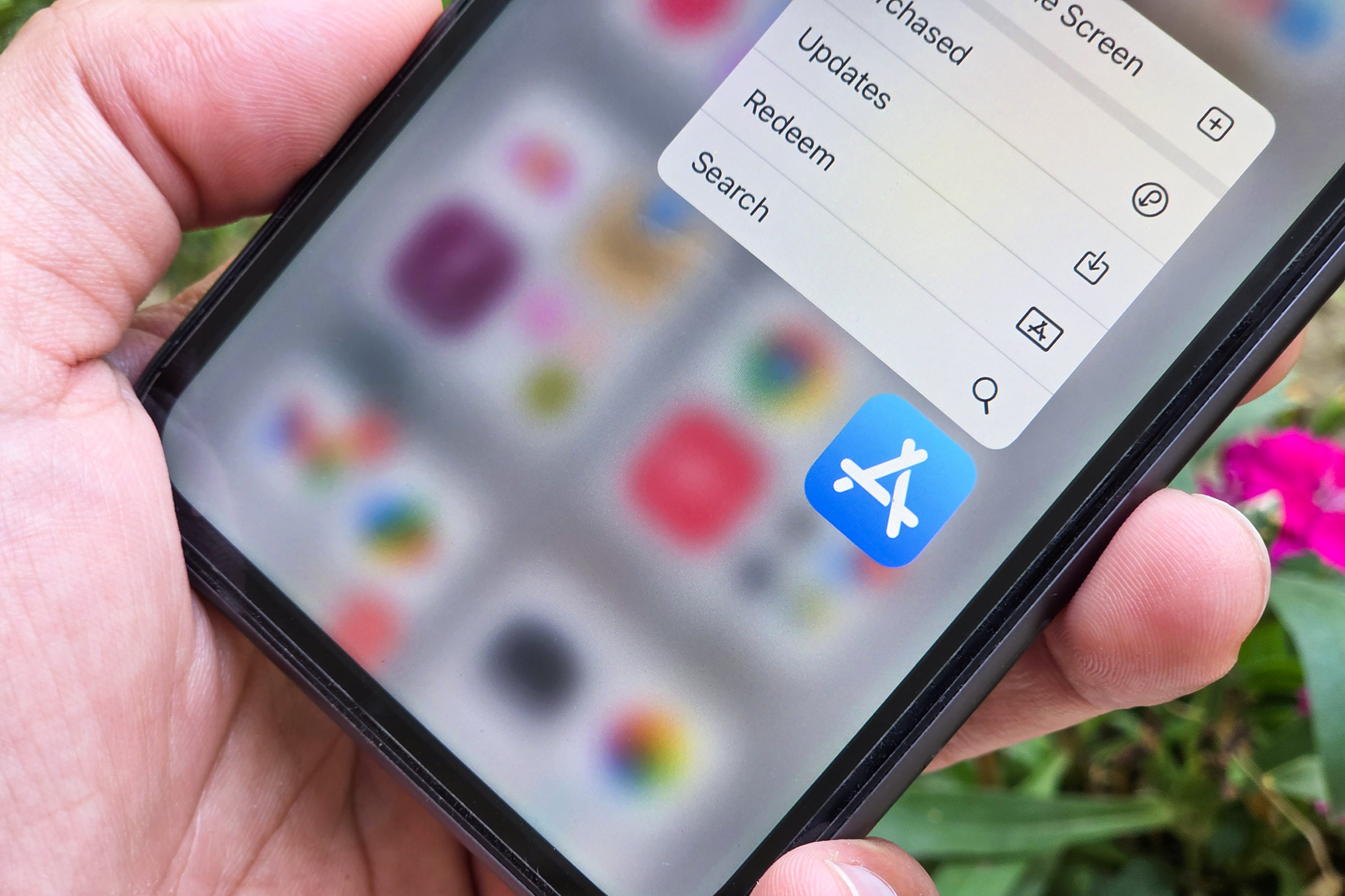 Close-up of iPhone screen displaying the Apple App Store logo, illustrating the need for better third-party app integration in iOS 19.