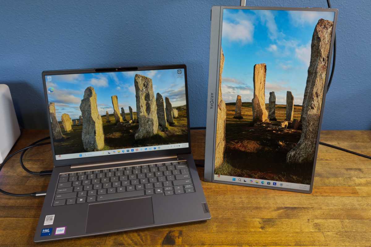 Arzopa Z1FC portable monitor with its integrated kickstand deployed on a desk, showcasing its slim design.
