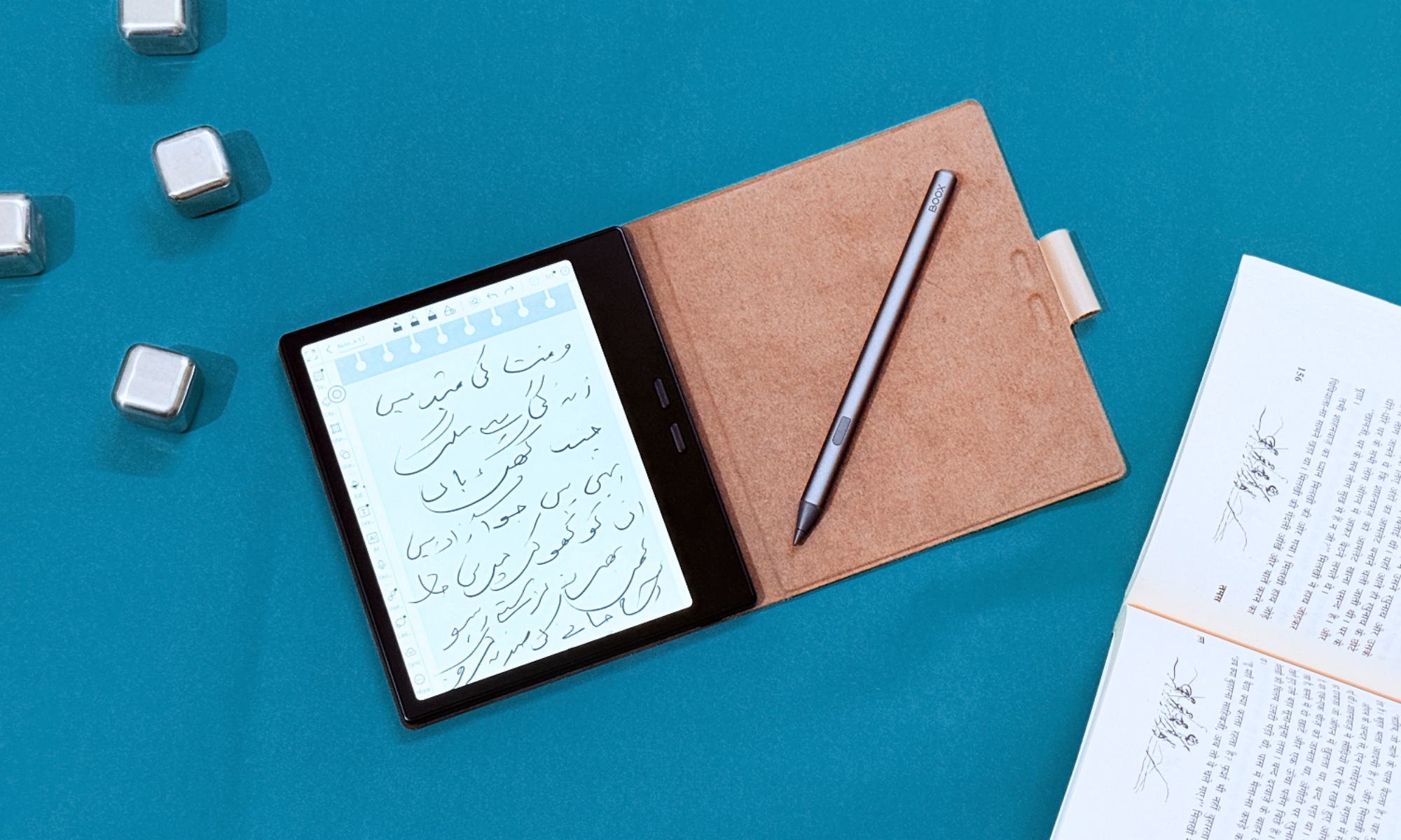 Boox Go 7 E Ink tablet shown with its stylus and protective magnetic folio cover.