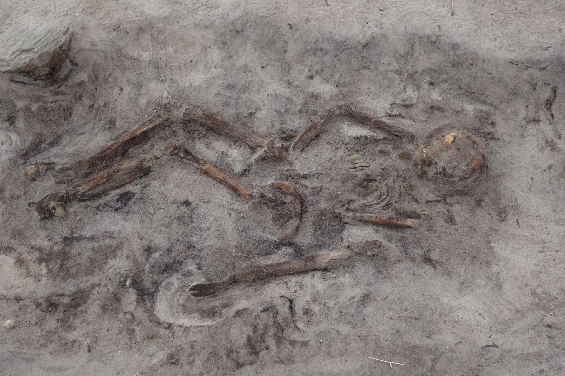 Archaeological site showing remains from a Viking woman's boat grave on Senja Island, Norway.