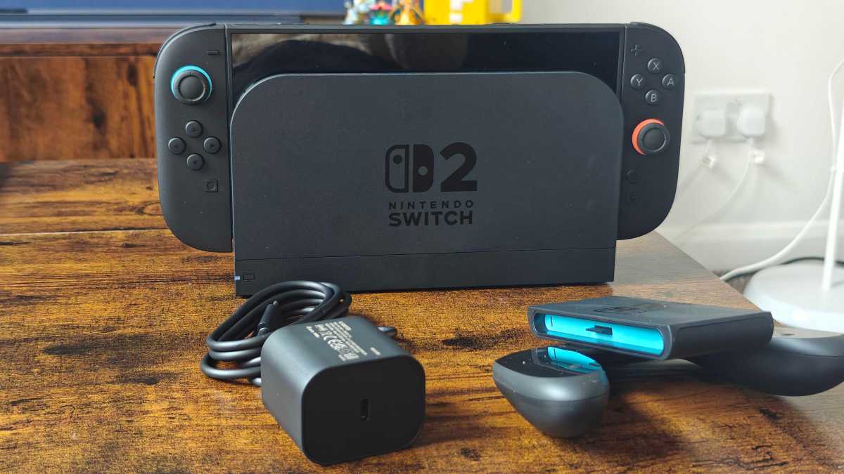 Nintendo Switch 2 console and accessories unboxed, including Joy-Cons, dock, and power adapter.