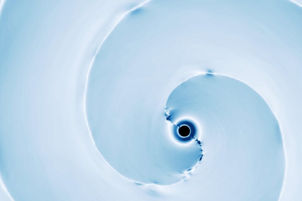 Caltech simulation depicting magnetized plasma outflows erupting from a black hole-neutron star merger.