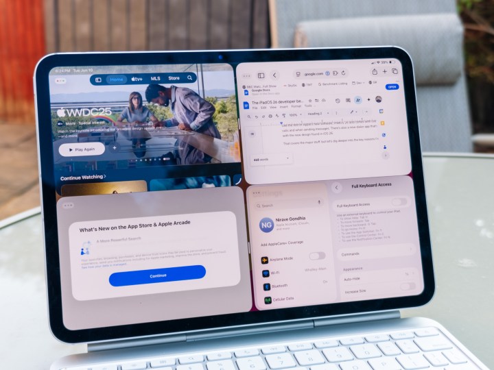 iPad Pro M4 11-inch displaying true multitasking with four resizable app windows open in iPadOS 26.
