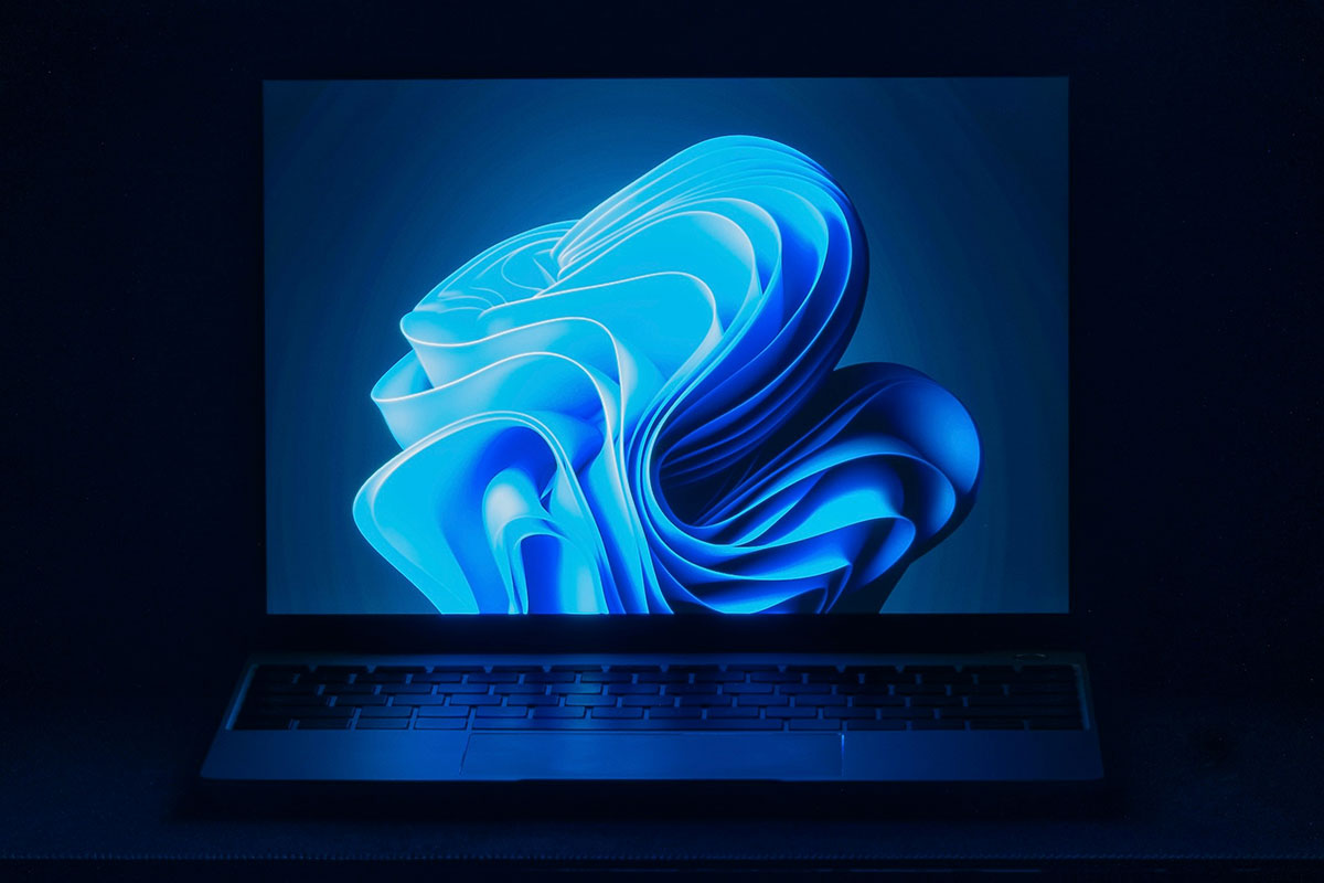 Desktop displaying the Windows 11 bloom wallpaper, symbolizing an upgrade.