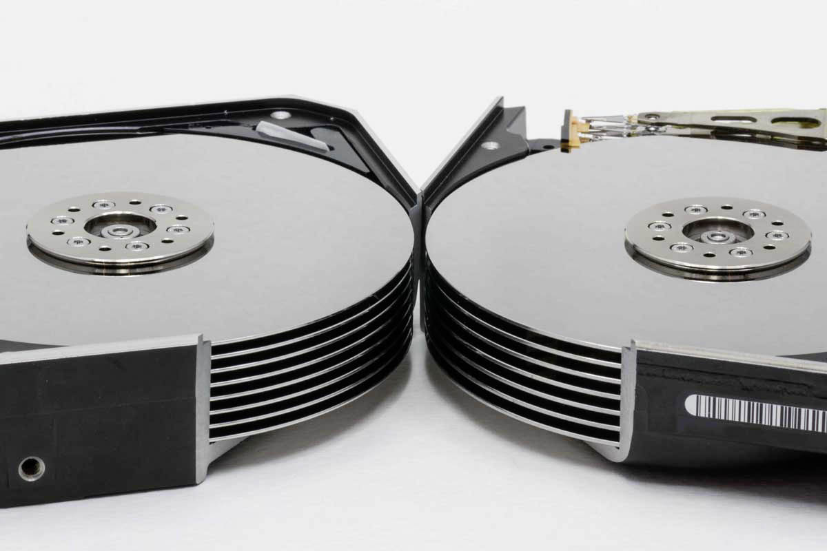 Internal view of a helium-filled hard drive showcasing multiple platters and mechanics, demonstrating advanced storage technology.